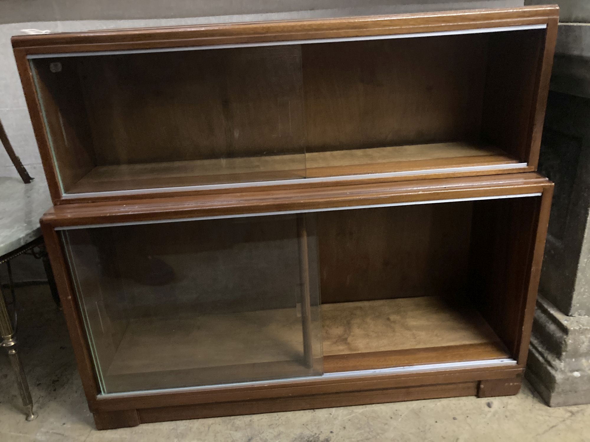 A pair of Minty style teak two section bookcases, width 89cm depth 29cm height 76cm